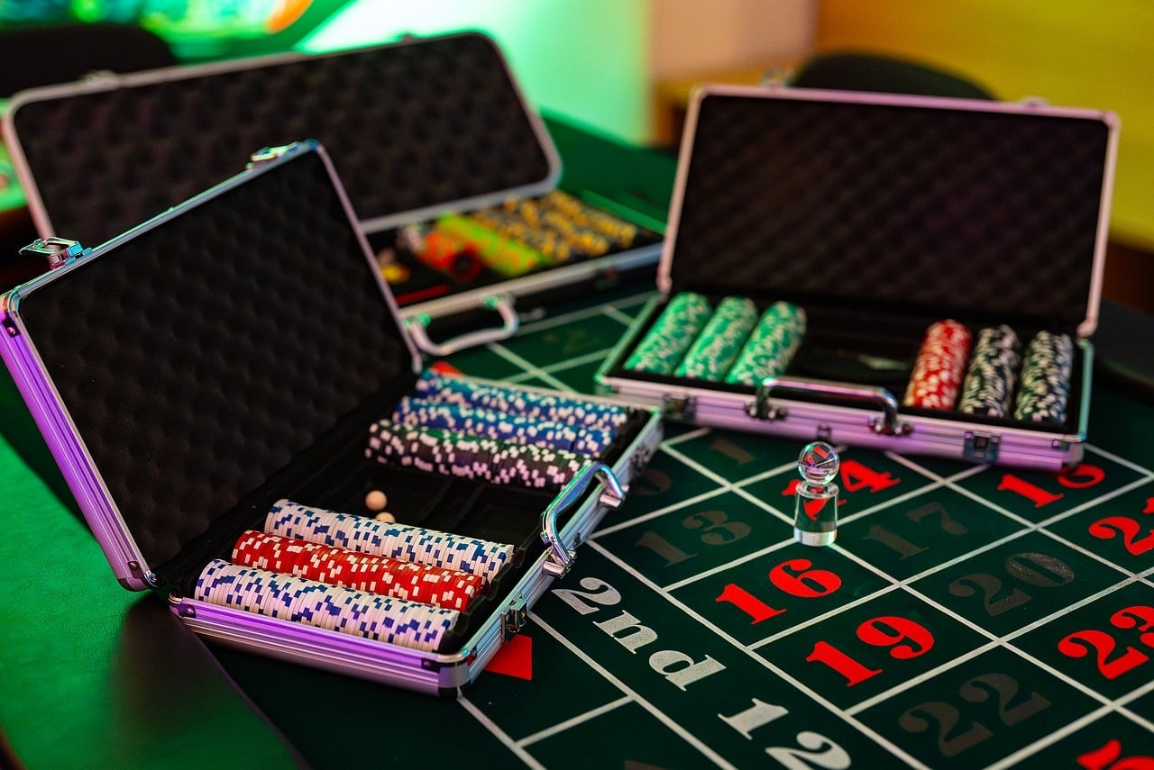 Open chip cases on a roulette layout in the Hemlockcovemanor gaming lounge